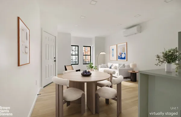 a view of a dining room with furniture and window