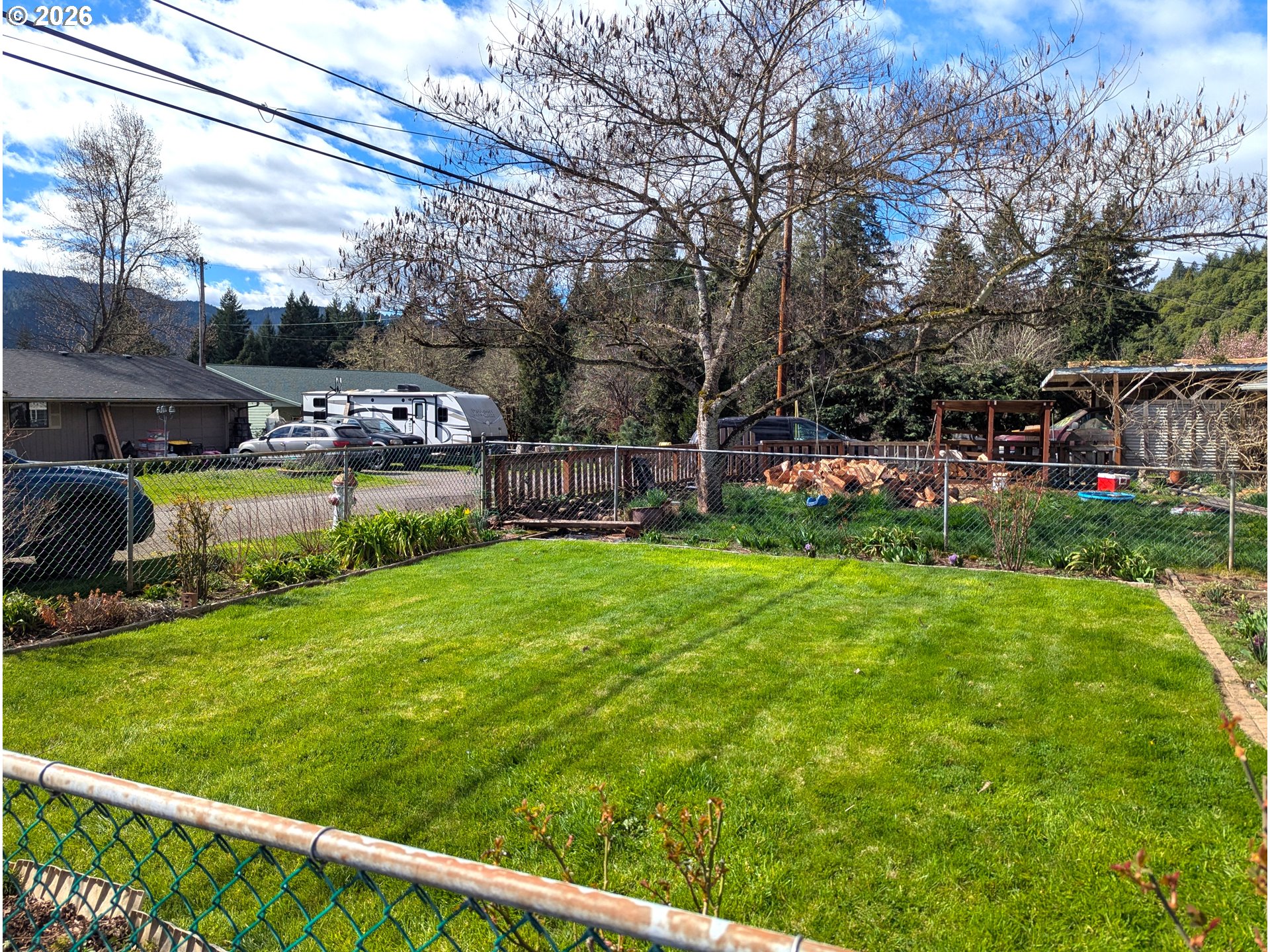 48379 7th Street Oakridge, OR 97463 - Photo 5 of 5 a view of a house with backyard and sitting area
