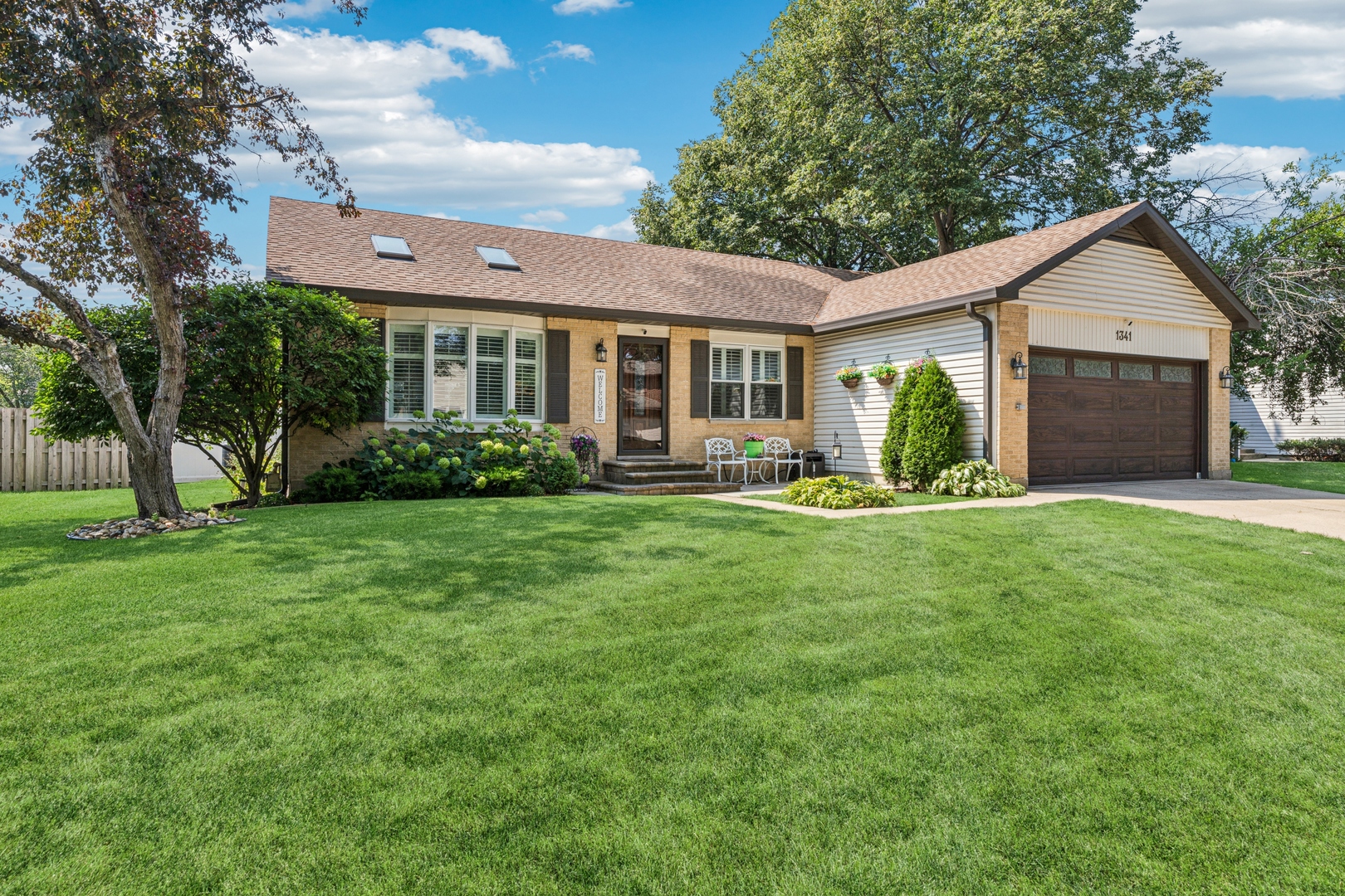 1341 Rose Boulevard Buffalo Grove, IL 60089 - Photo 1 of 19 a front view of house with yard and green space