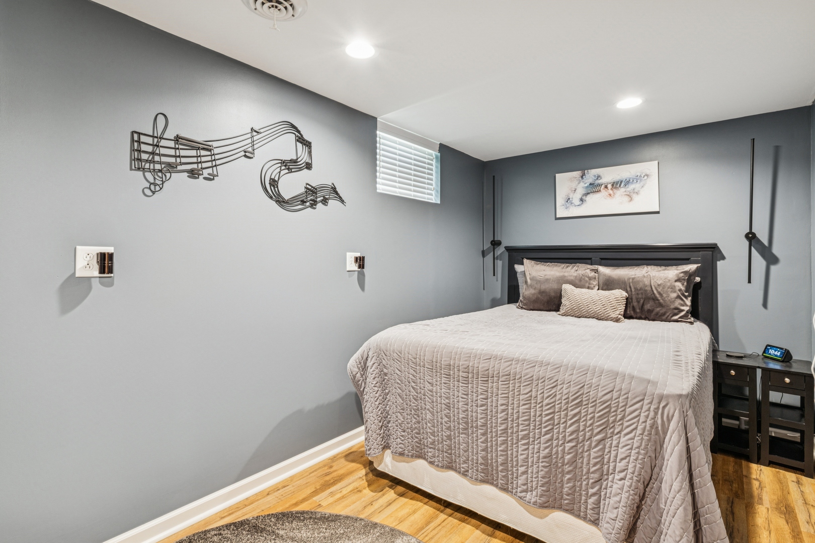 1341 Rose Boulevard Buffalo Grove, IL 60089 - Photo 12 of 19 a bedroom with a bed and painting on the wall