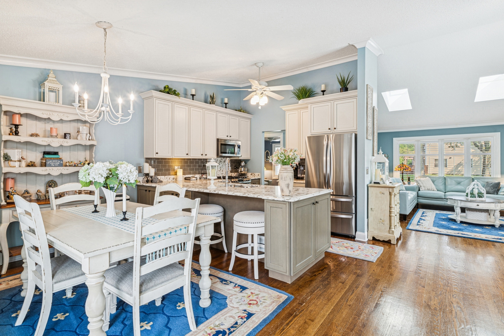 1341 Rose Boulevard Buffalo Grove, IL 60089 - Photo 3 of 19 a kitchen with a refrigerator a stove a sink dishwasher with a dining table and chairs with wooden floor