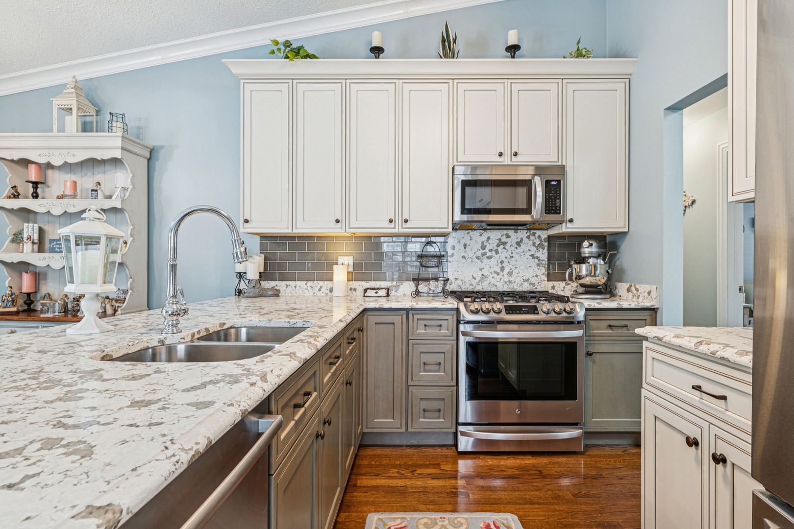 1341 Rose Boulevard Buffalo Grove, IL 60089 - Photo 4 of 19 a kitchen with granite countertop a sink stove and cabinets