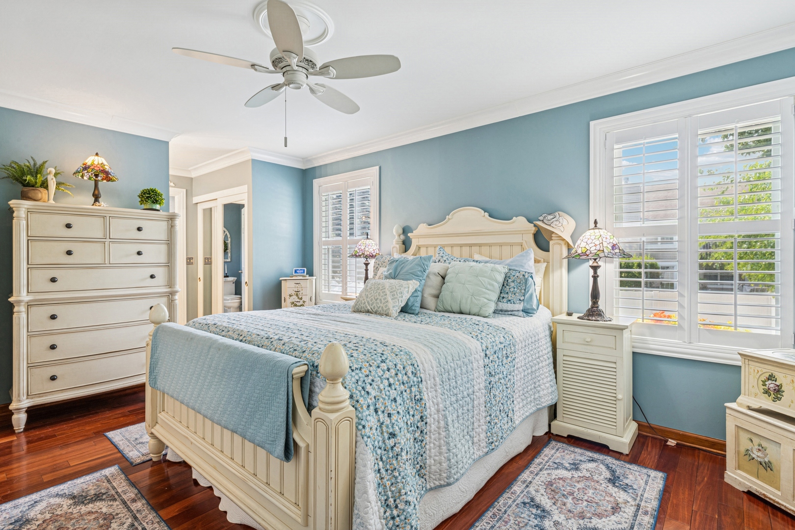 1341 Rose Boulevard Buffalo Grove, IL 60089 - Photo 7 of 19 a bedroom with a bed and a chandelier