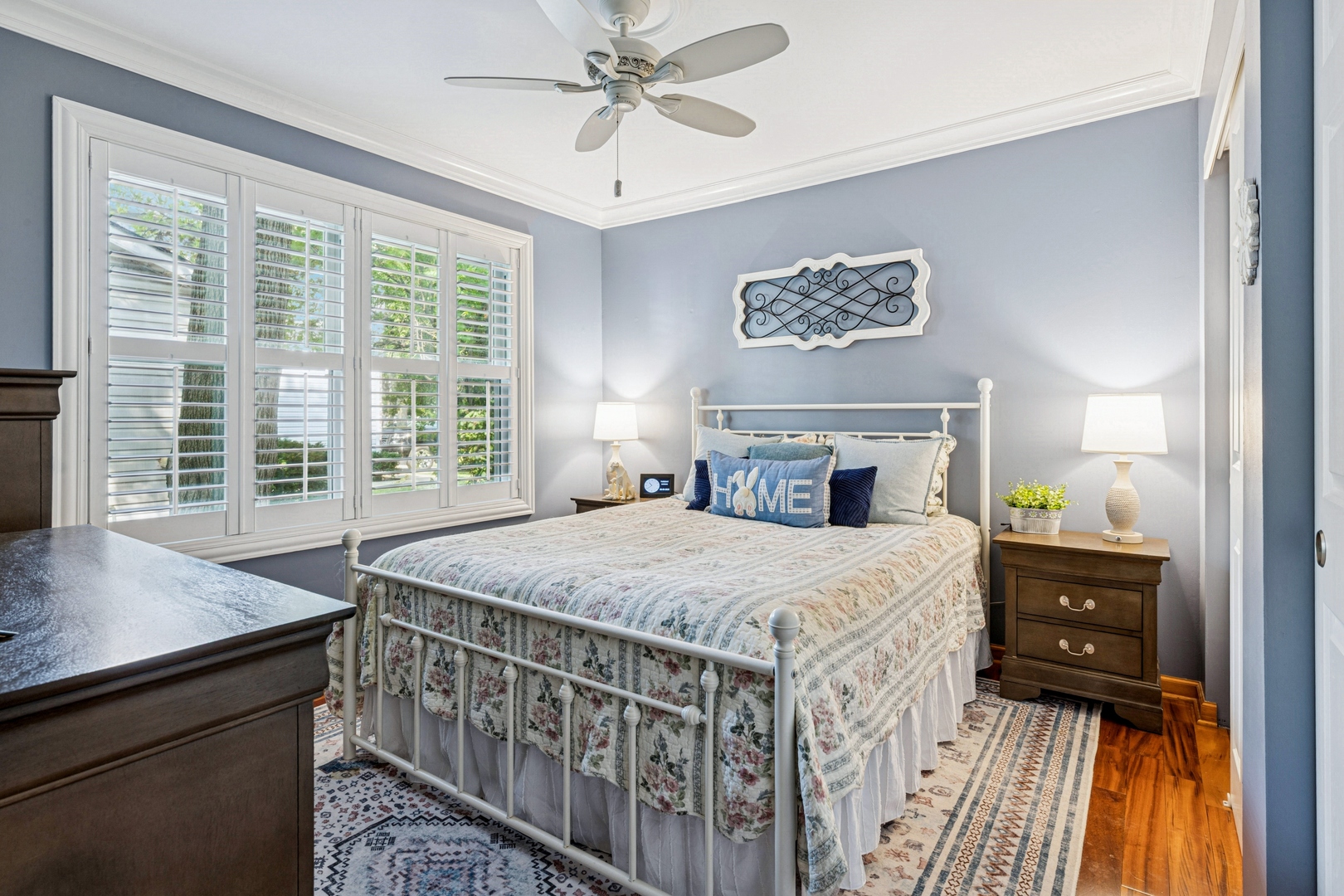 1341 Rose Boulevard Buffalo Grove, IL 60089 - Photo 10 of 19 a bedroom with a bed and a chandelier