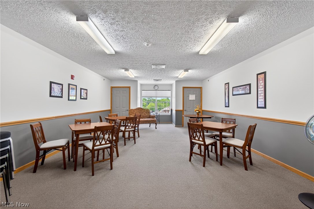 4703 Hills And Dales Road Northwest Canton, OH 44708 - Photo 22 of 25 spacious area with tables for game night or dinner