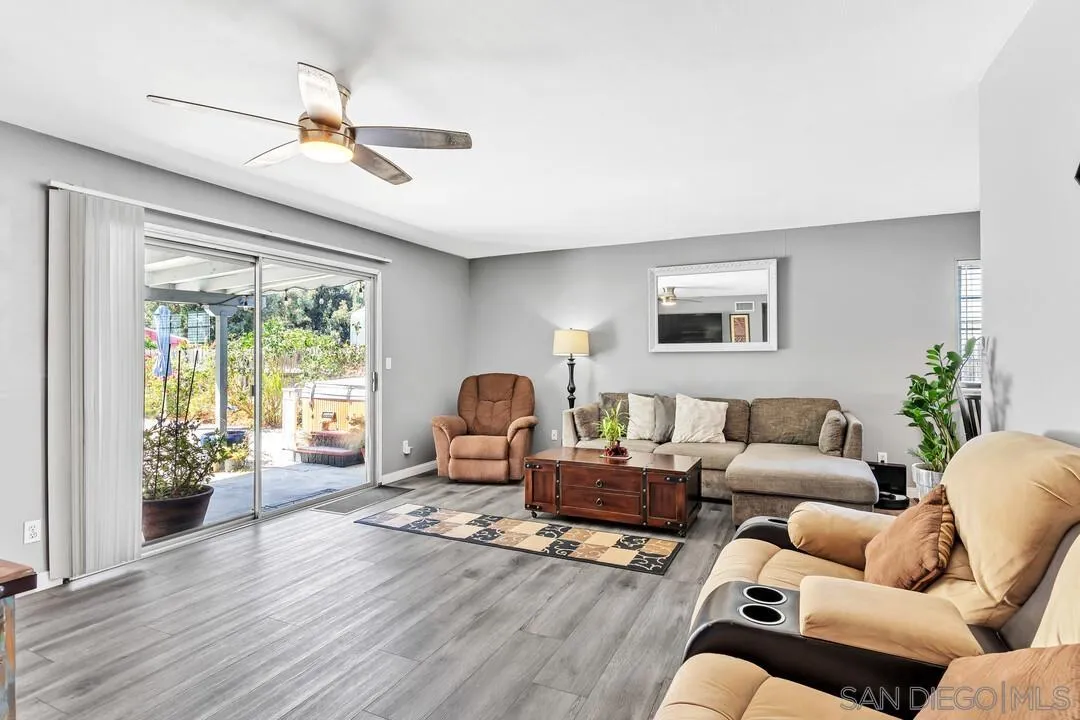 13611 Los Coches Road East El Cajon, CA 92021 - Photo 2 of 34 a living room with furniture and a large window