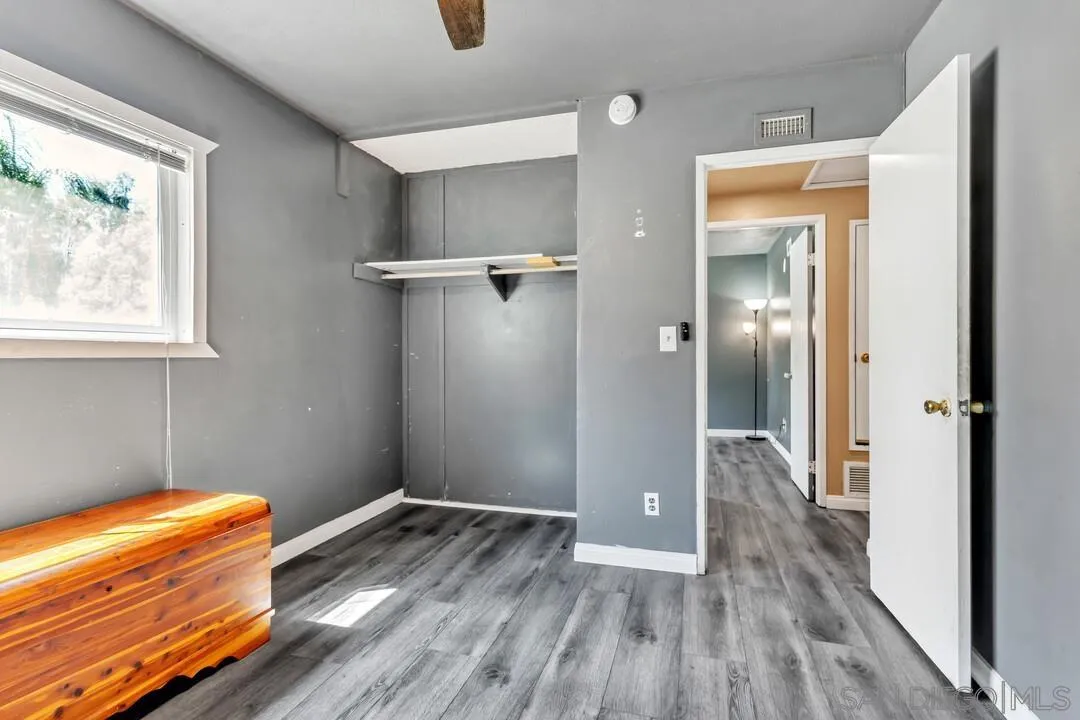 13611 Los Coches Road East El Cajon, CA 92021 - Photo 21 of 34 a view of room with wooden floor