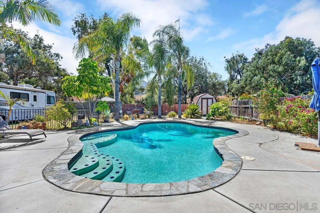 13611 Los Coches Road East El Cajon, CA 92021 - Photo 23 of 34 a view of a swimming pool with sitting area