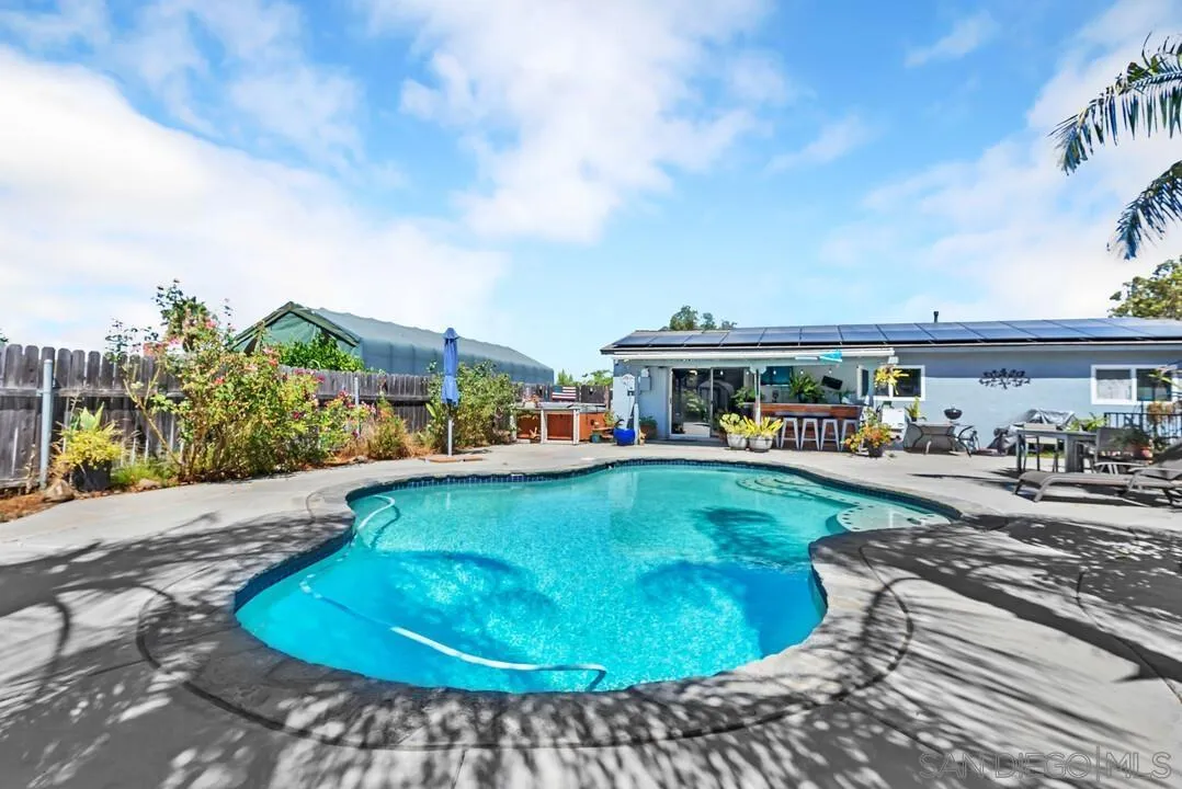 13611 Los Coches Road East El Cajon, CA 92021 - Photo 25 of 34 a view of a swimming pool with lawn chairs