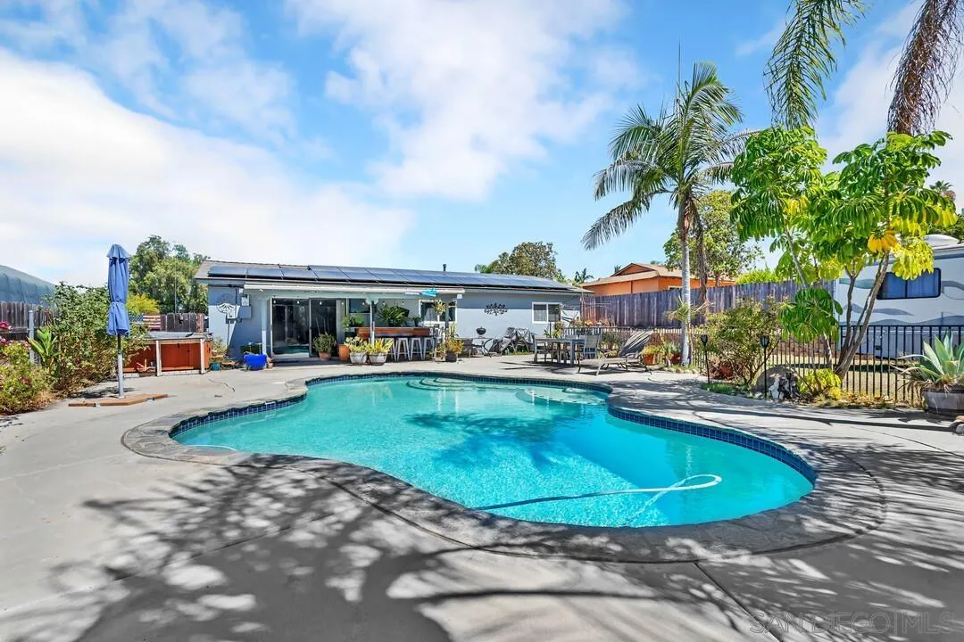 13611 Los Coches Road East El Cajon, CA 92021 - Photo 26 of 34 a view of a swimming pool with lawn chairs and plants