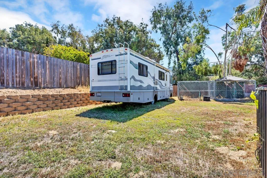13611 Los Coches Road East El Cajon, CA 92021 - Photo 28 of 34 a front view of a house with garden