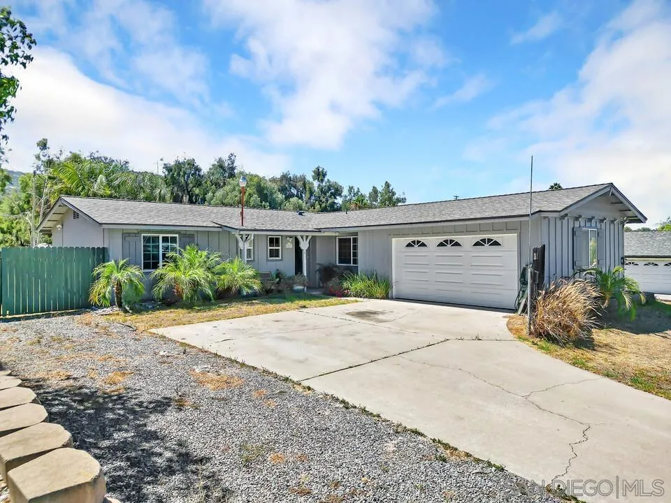 13611 Los Coches Road East El Cajon, CA 92021 - Photo 30 of 34 a front view of a house with a yard