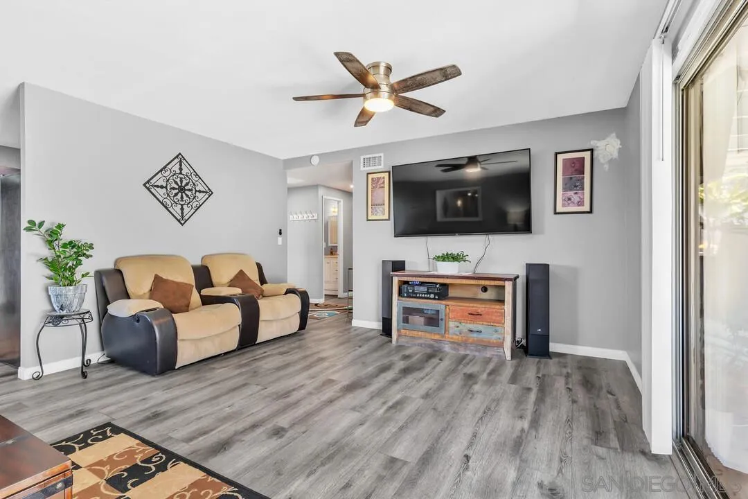 13611 Los Coches Road East El Cajon, CA 92021 - Photo 4 of 34 a living room with furniture and a flat screen tv
