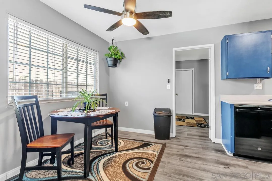 13611 Los Coches Road East El Cajon, CA 92021 - Photo 5 of 34 a view of a dining room with furniture window and wooden floor
