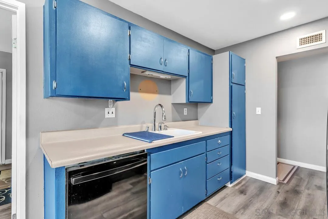 13611 Los Coches Road East El Cajon, CA 92021 - Photo 8 of 34 a kitchen with a sink stove and cabinets