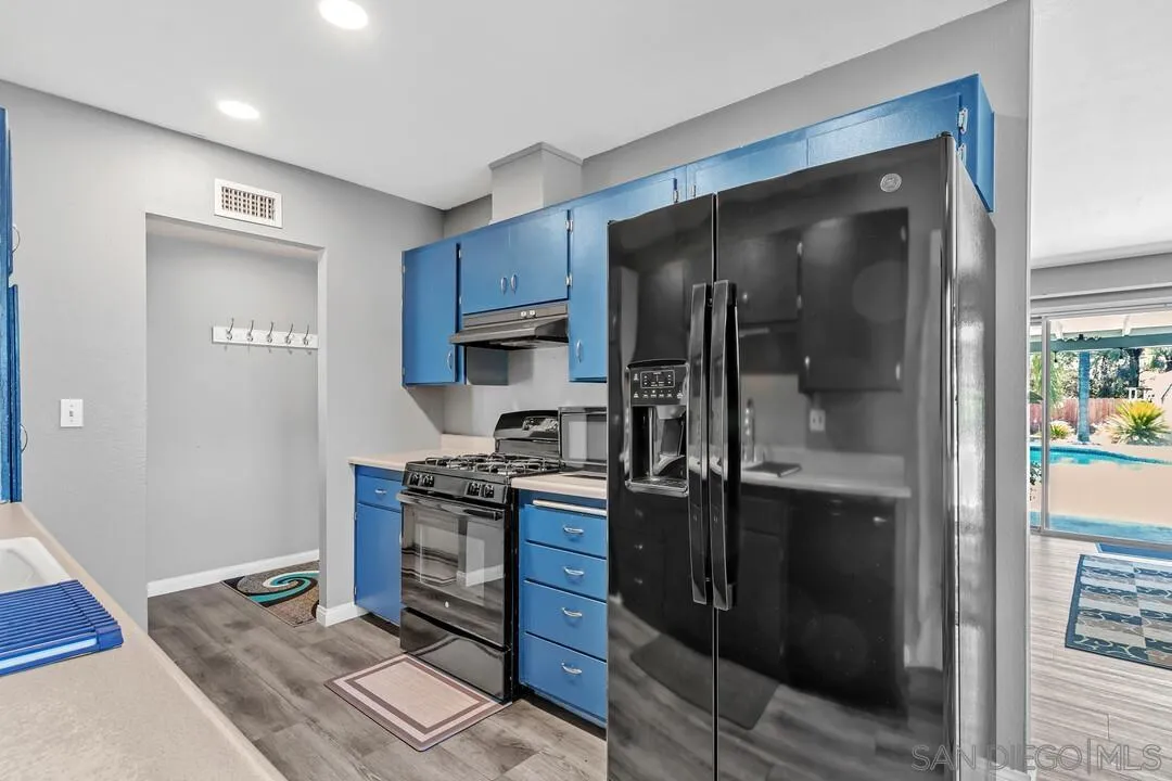 13611 Los Coches Road East El Cajon, CA 92021 - Photo 9 of 34 a kitchen with a refrigerator and a sink
