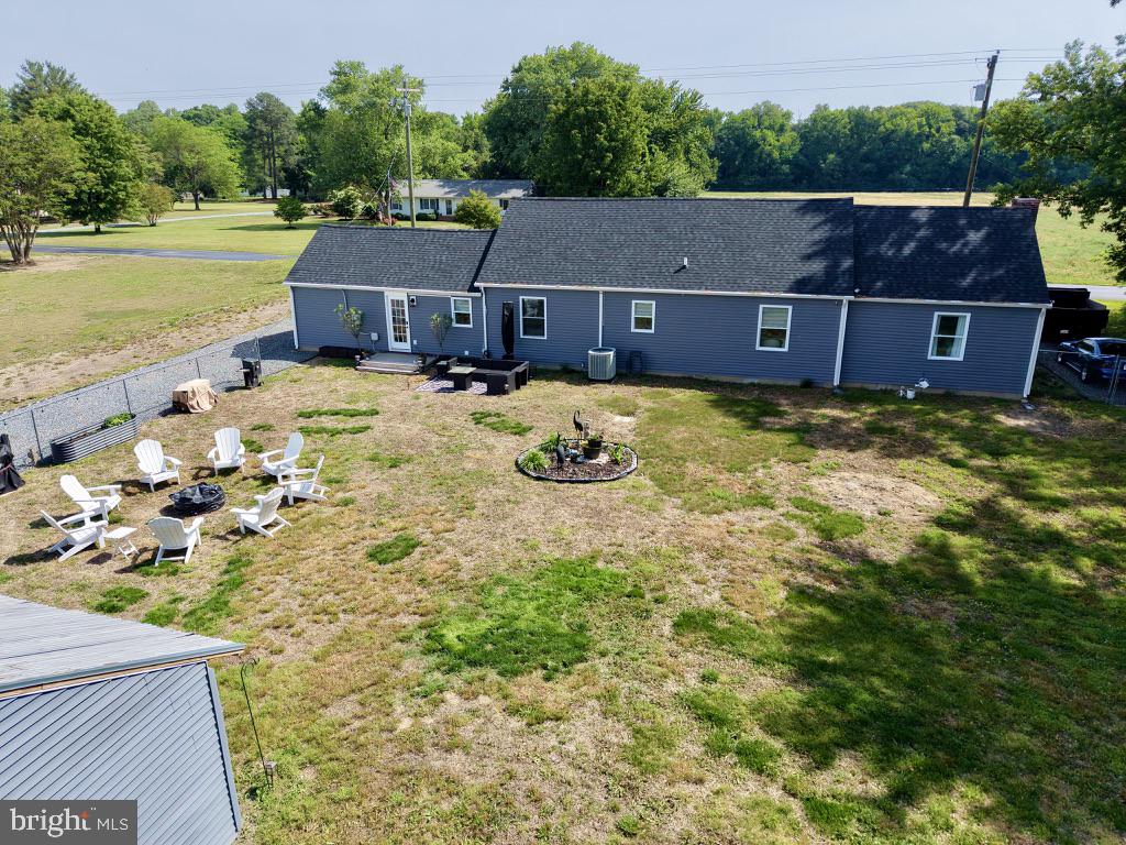 25485 Hignutt Road Denton, MD 21629 - Photo 36 of 52 a view of a swimming pool with a yard