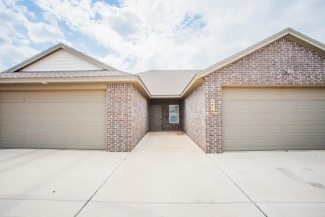 a front view of a house with a garage