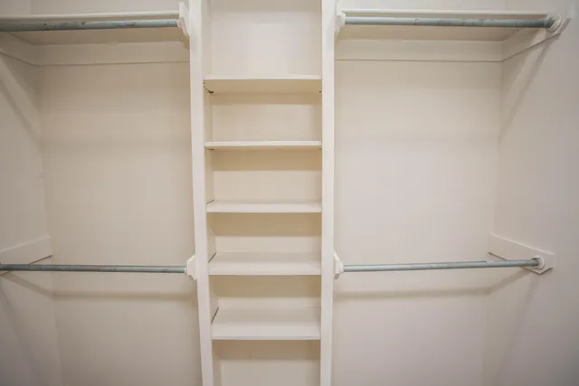 a view of an empty walk in closet