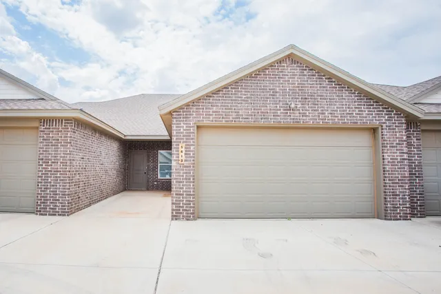 a bathroom with a window and a shower