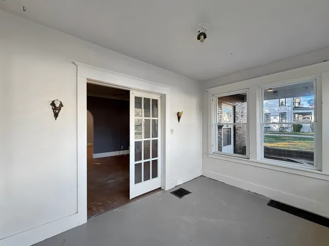 wooden floor and window in an empty room