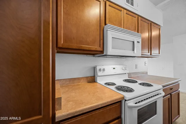 a kitchen with a stove and a microwave