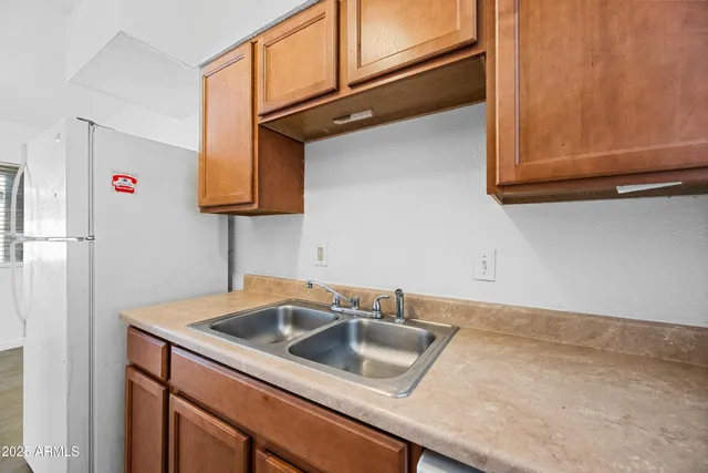a kitchen with a sink and cabinets