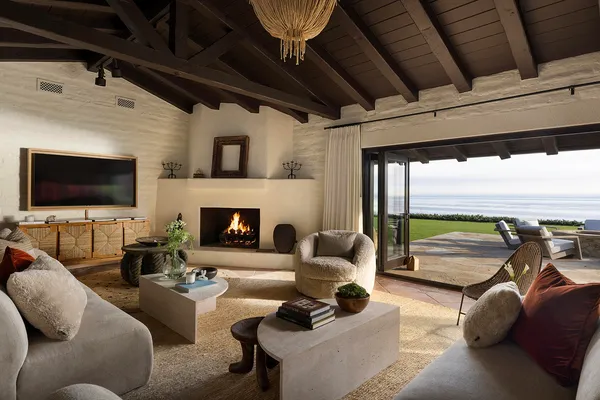 a living room with furniture a rug and a flat screen tv