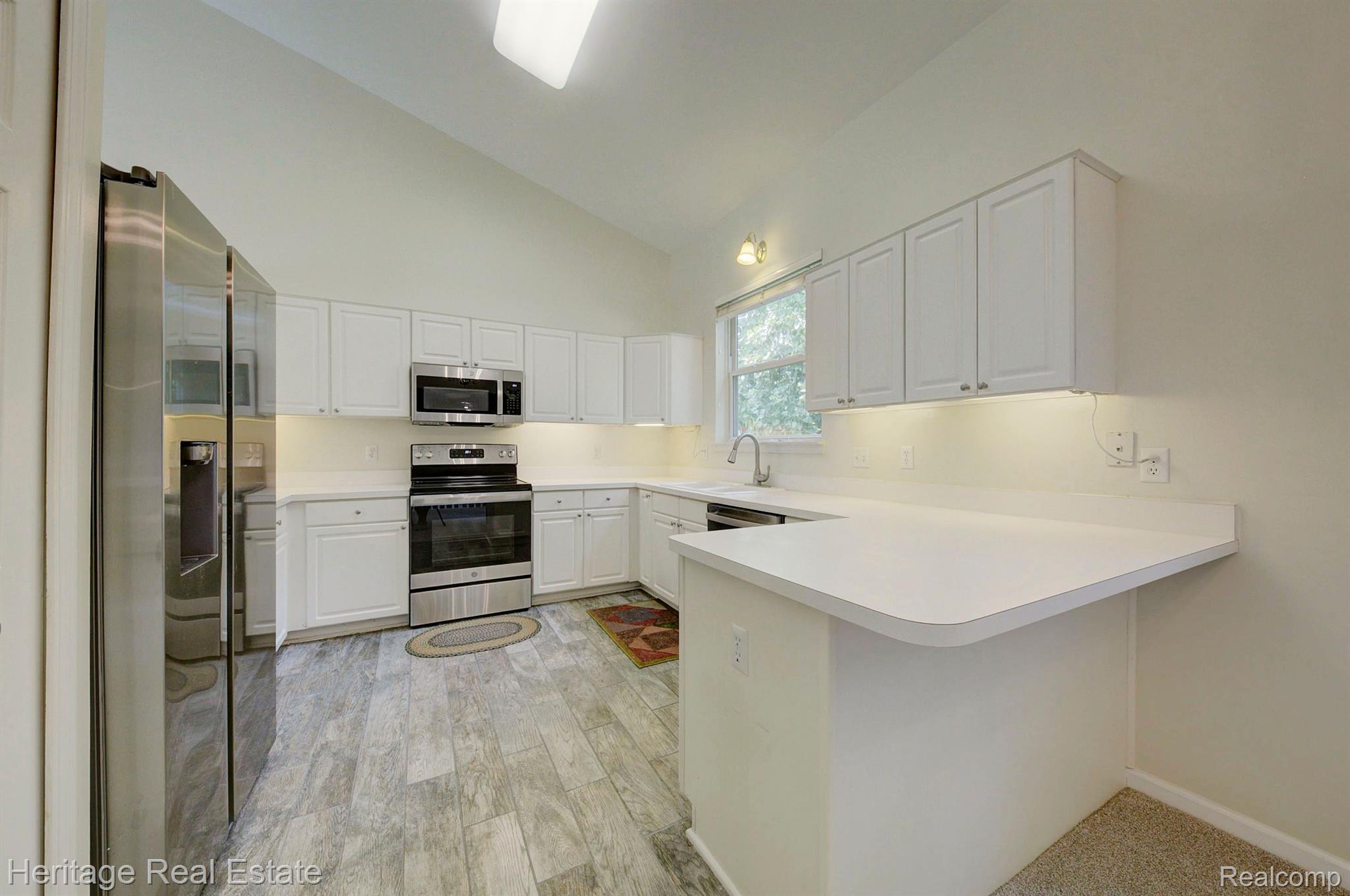 117 Eagle Ridge Road Lake Orion, MI 48360 - Photo 14 of 61 Kitchen has new range, microwave and dishwasher