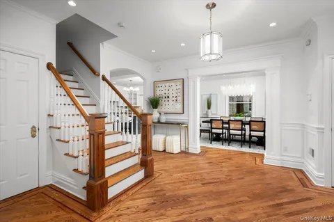 a view of a livingroom with furniture and staircase