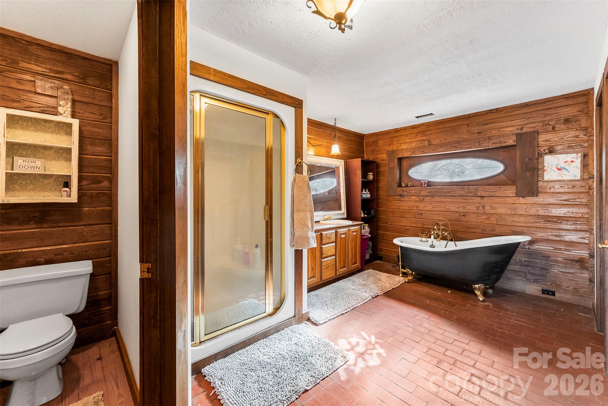 5011 Medlin Road Monroe, NC 28112 - Photo 12 of 37 a bathroom with a sink toilet and shower