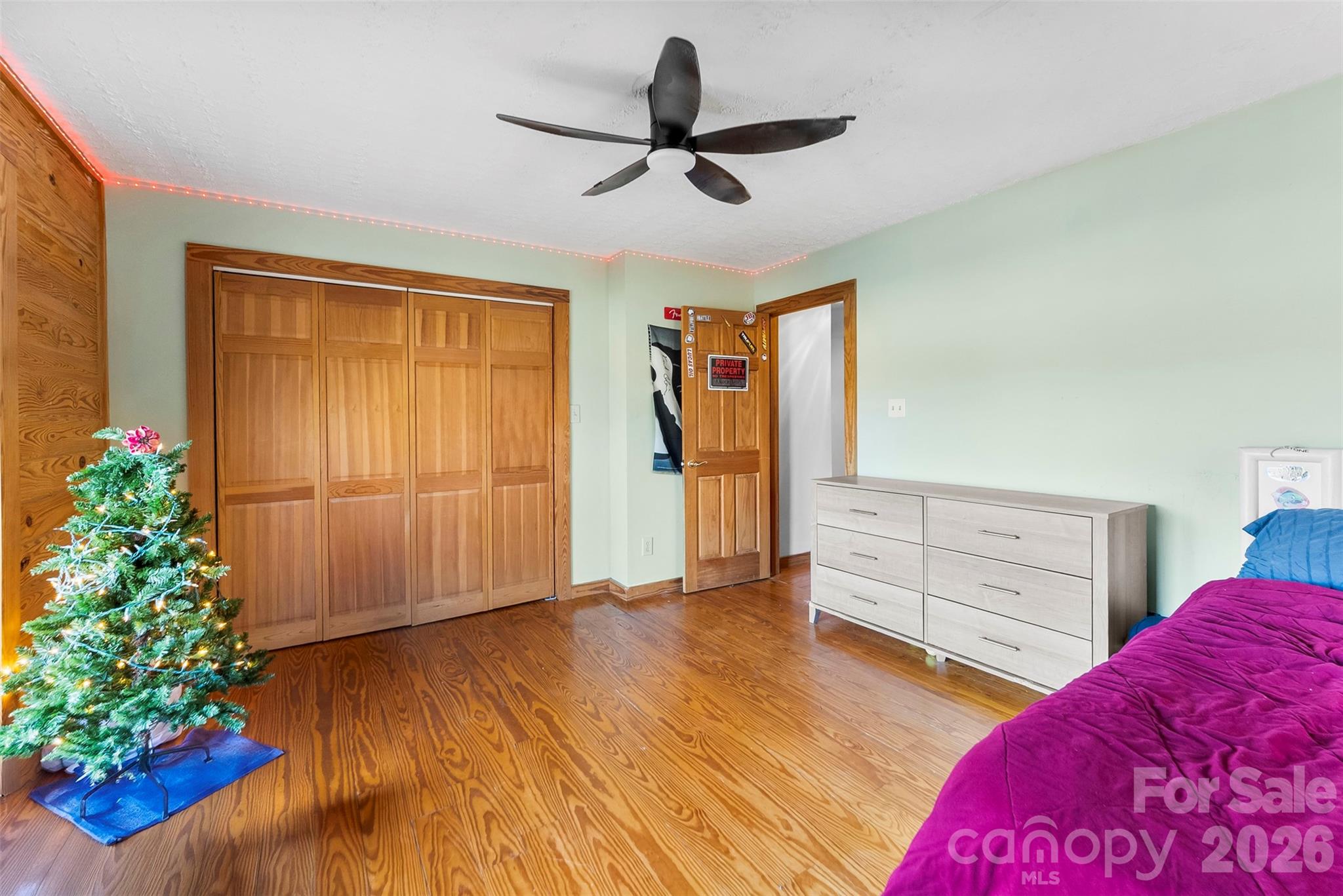 5011 Medlin Road Monroe, NC 28112 - Photo 20 of 37 a bedroom with furniture and a potted plant