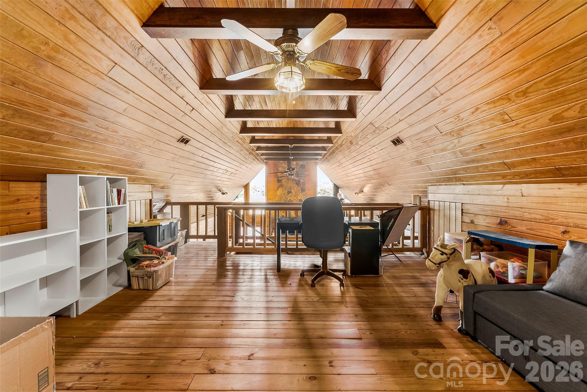 5011 Medlin Road Monroe, NC 28112 - Photo 22 of 37 a view of a livingroom with furniture and a ceiling fan