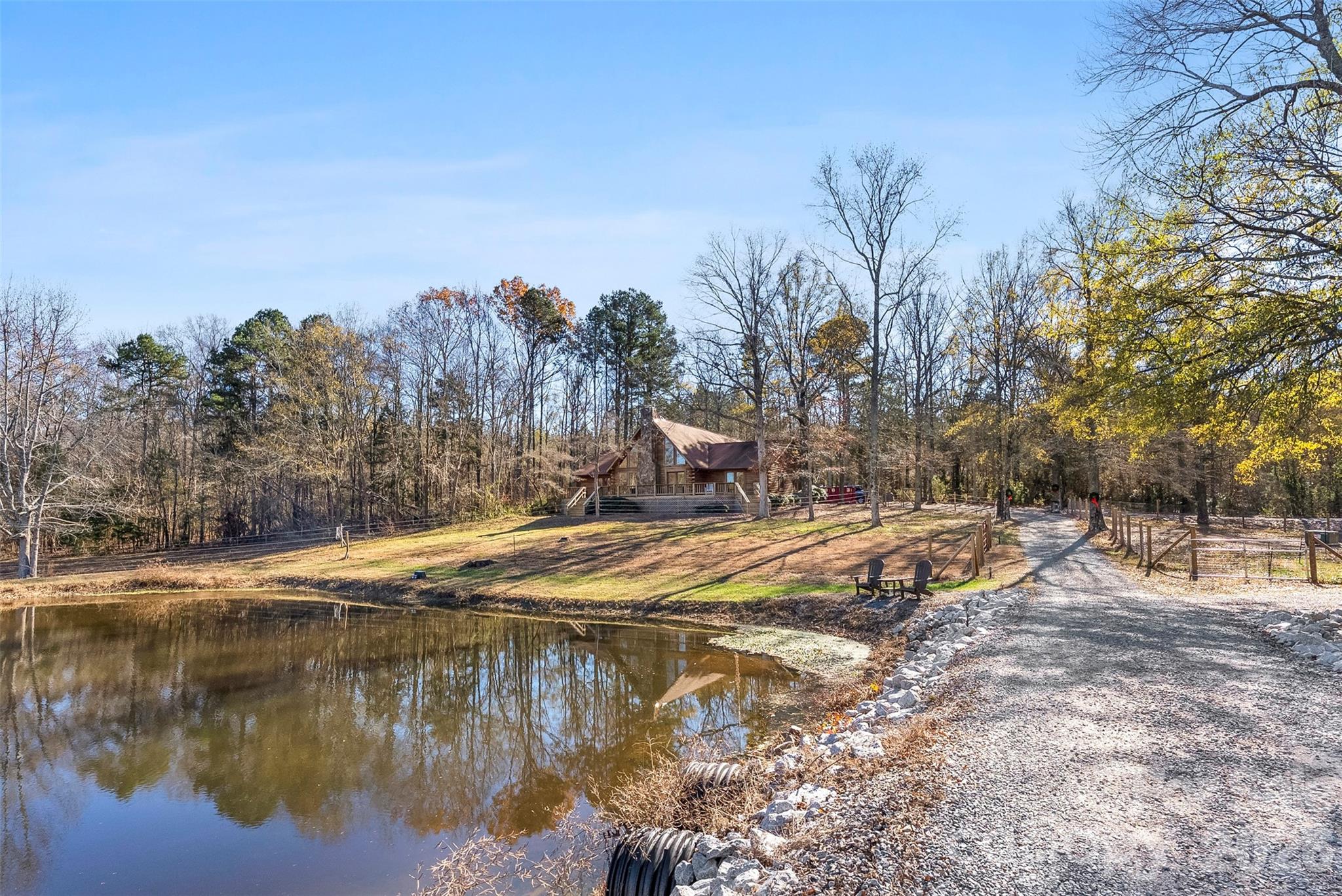 5011 Medlin Road Monroe, NC 28112 - Photo 25 of 37 a view of a lake with a mountain