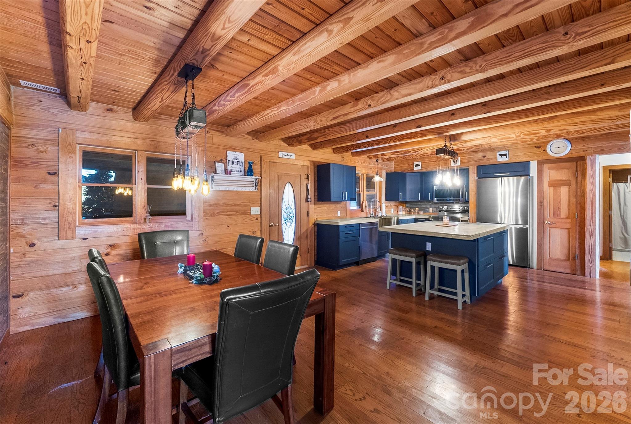 5011 Medlin Road Monroe, NC 28112 - Photo 3 of 37 a view of a dining room with furniture and wooden floor