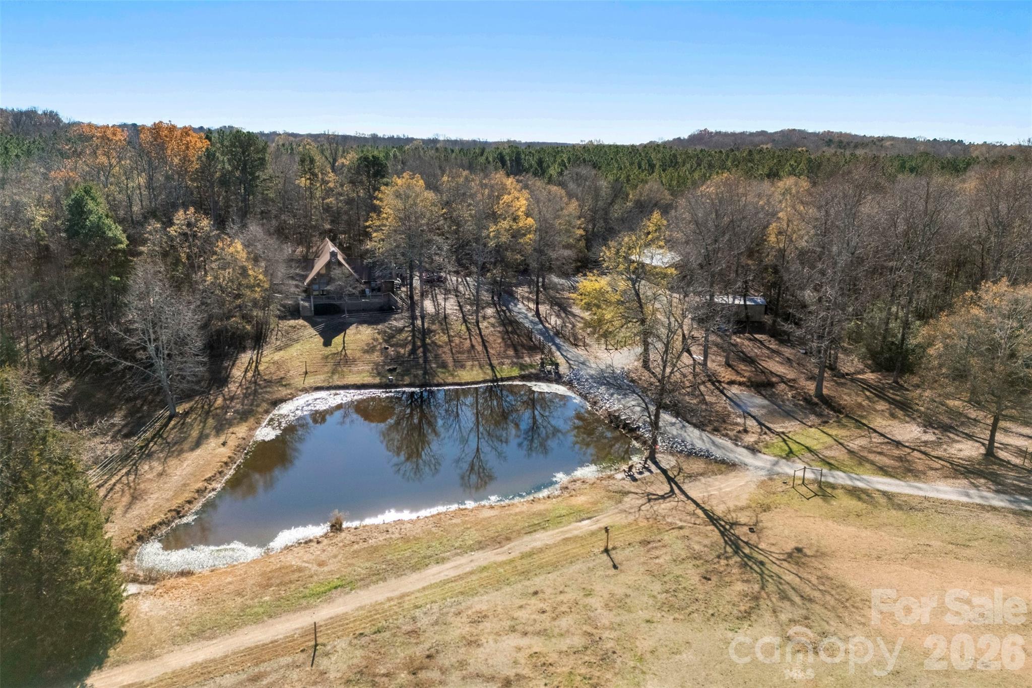 5011 Medlin Road Monroe, NC 28112 - Photo 34 of 37 a view of a water pond with mountain view