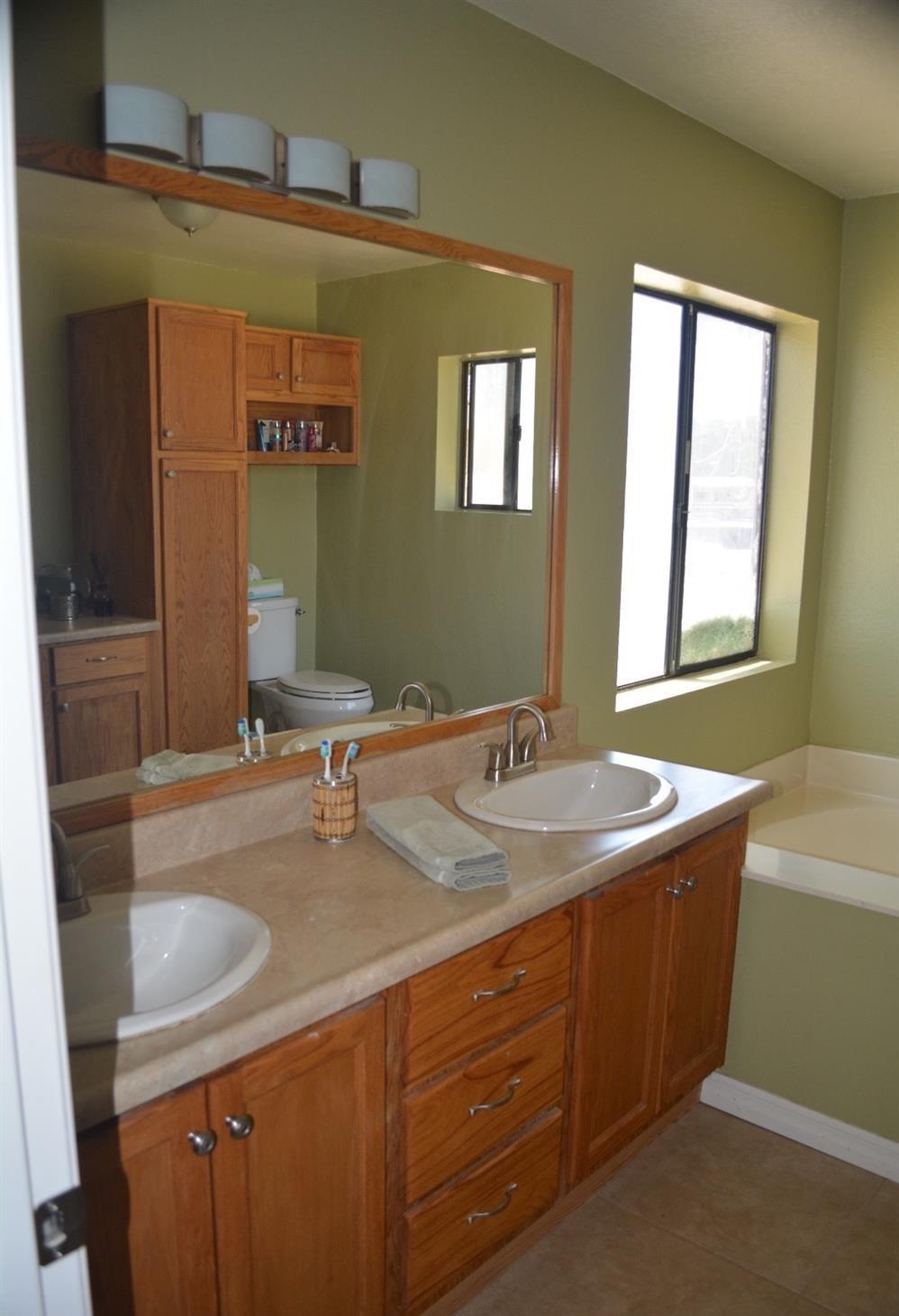 4780 Montiverde Road Mojave, CA 93501 - Photo 16 of 52 a bathroom with a sink and a mirror