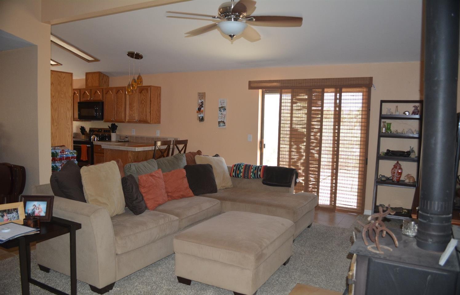 4780 Montiverde Road Mojave, CA 93501 - Photo 17 of 52 a living room with furniture and a flat screen tv