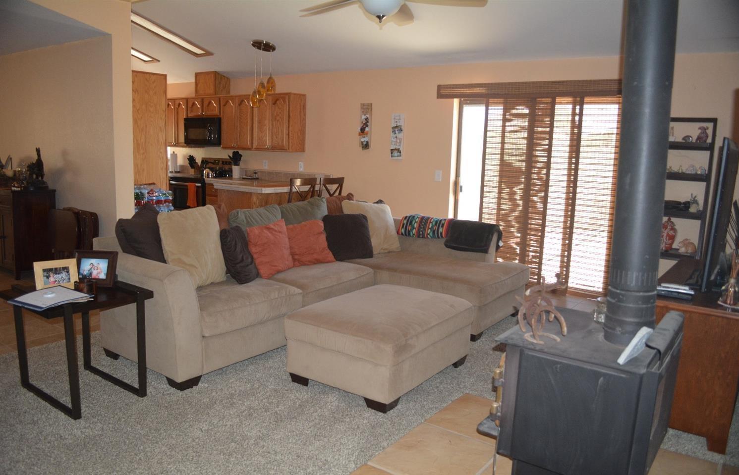4780 Montiverde Road Mojave, CA 93501 - Photo 4 of 52 a living room with furniture and a flat screen tv