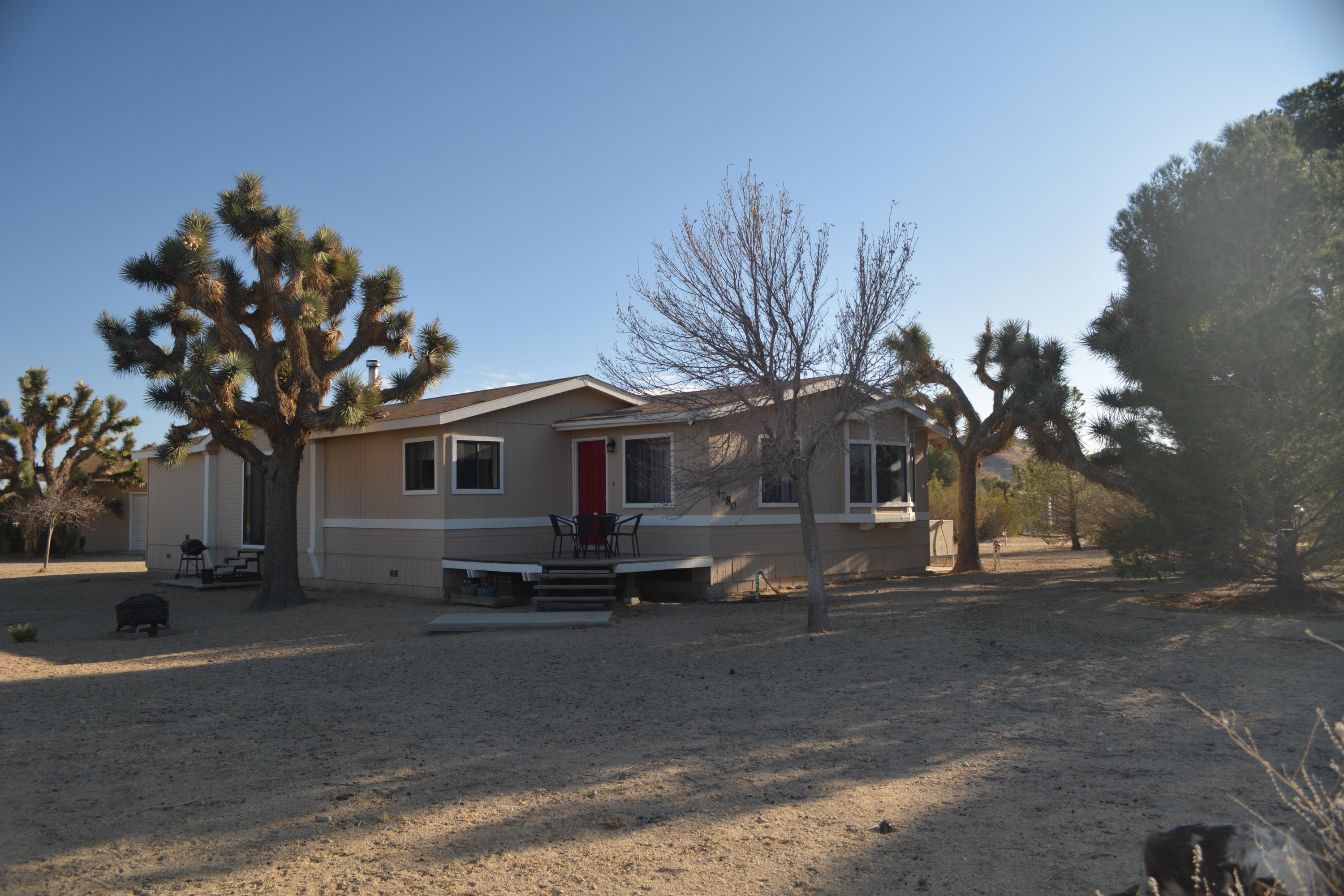 4780 Montiverde Road Mojave, CA 93501 - Photo 9 of 52 a front view of a house with a yard