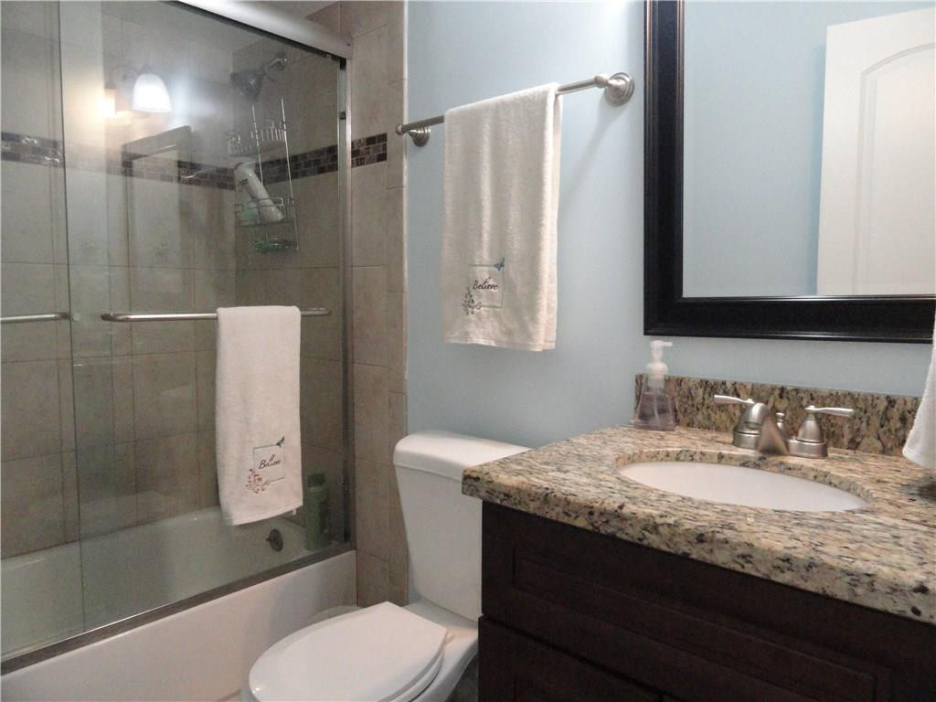 17950 Southwest 55th Street Southwest Ranches, FL 33331 - Photo 7 of 31 a bathroom with a granite countertop sink toilet and shower