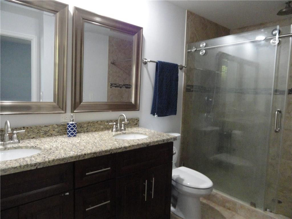 17950 Southwest 55th Street Southwest Ranches, FL 33331 - Photo 9 of 31 a bathroom with a sink and a mirror