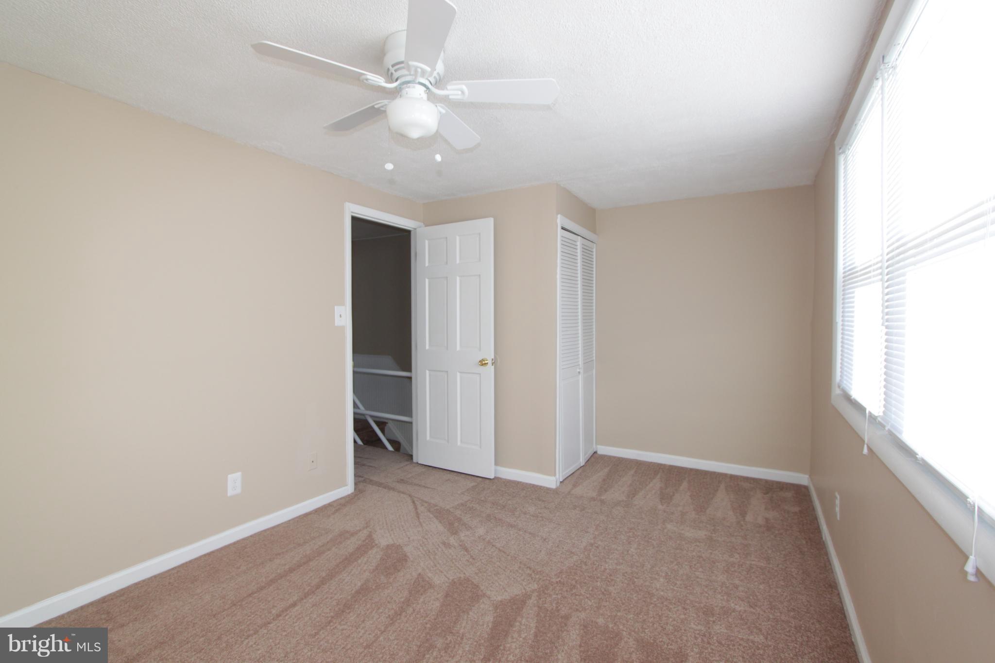 3111 Bero Road Baltimore, MD 21227 - Photo 12 of 25 a view of an empty room with a window