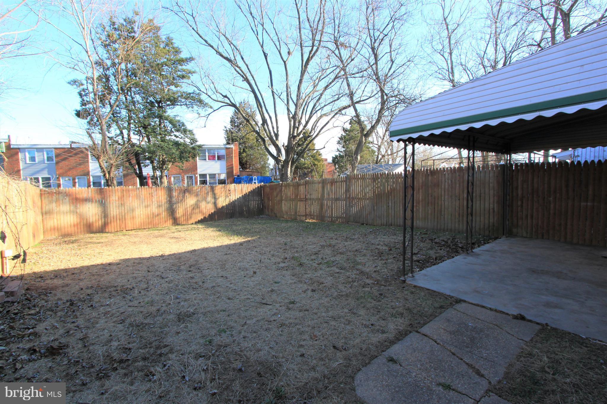 3111 Bero Road Baltimore, MD 21227 - Photo 13 of 25 a view of a yard with a tree