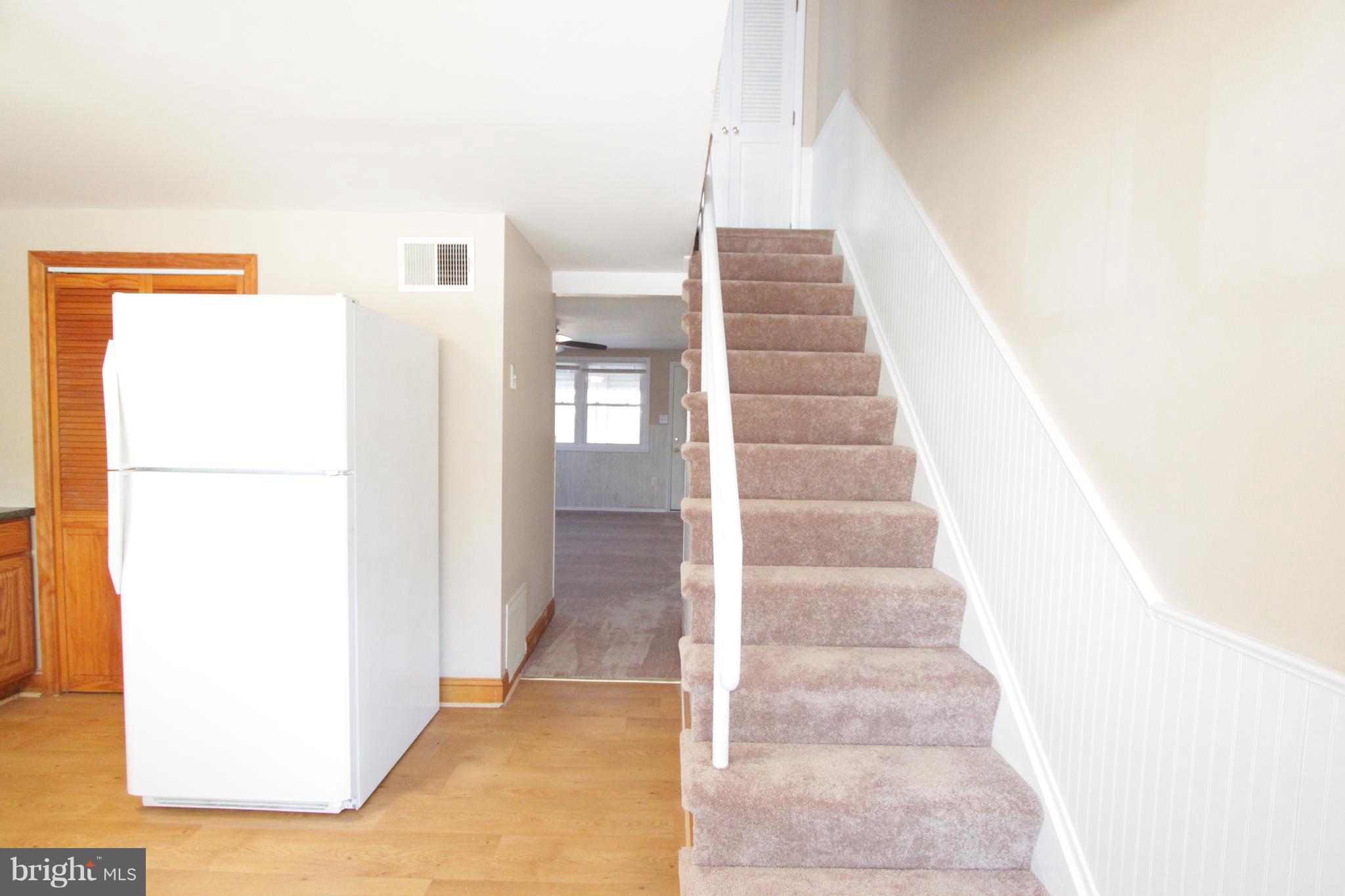 3111 Bero Road Baltimore, MD 21227 - Photo 15 of 25 a view of staircase with white walls