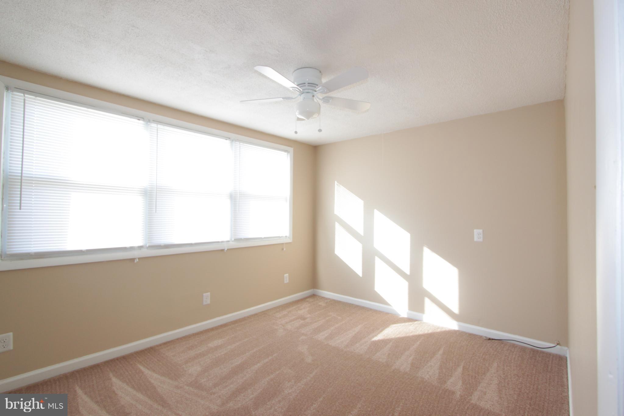 3111 Bero Road Baltimore, MD 21227 - Photo 17 of 25 a view of an empty room with a window