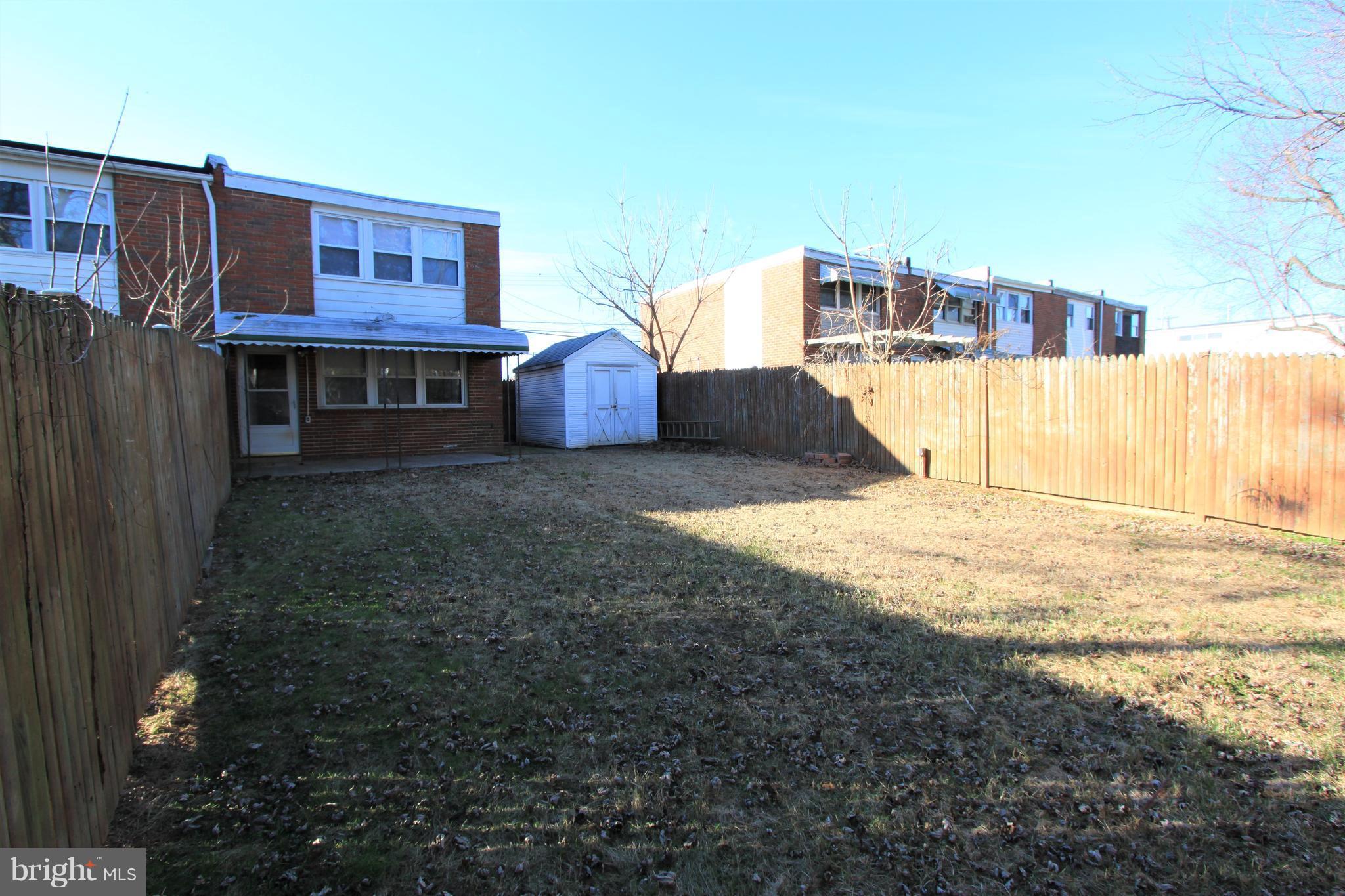 3111 Bero Road Baltimore, MD 21227 - Photo 21 of 25 a view of a house with a yard