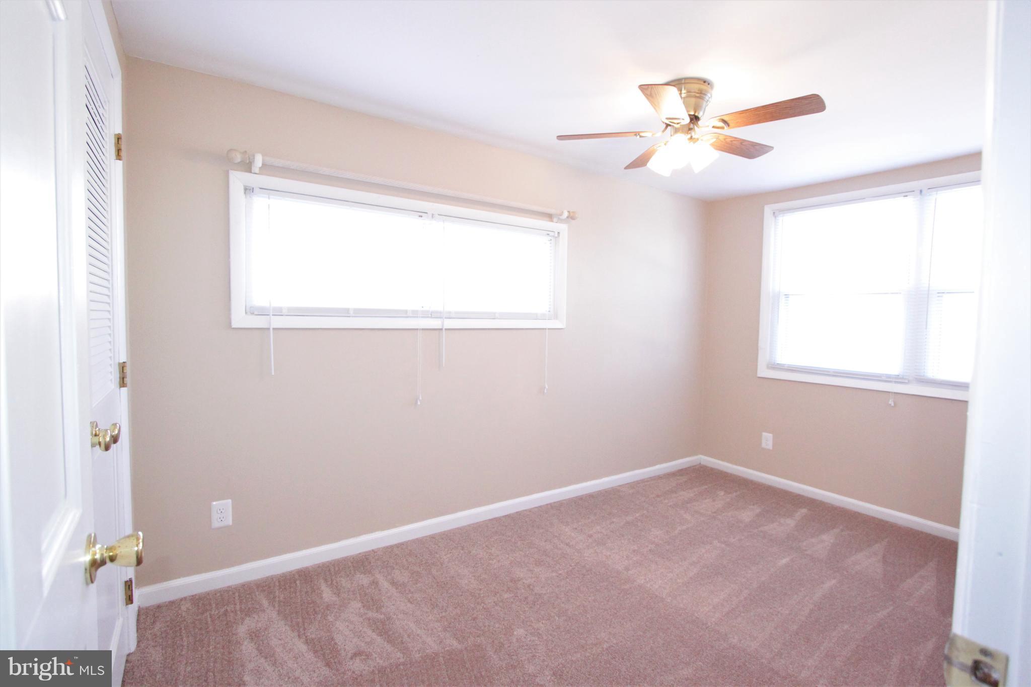 3111 Bero Road Baltimore, MD 21227 - Photo 7 of 25 a view of an empty room with a window