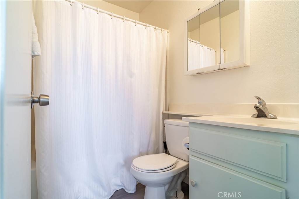 11688 Cornell Street Adelanto, CA 92301 - Photo 16 of 40 a bathroom with a sink a toilet and a mirror