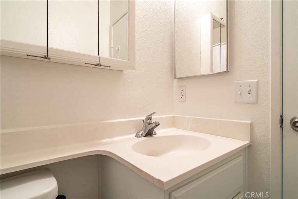 11688 Cornell Street Adelanto, CA 92301 - Photo 17 of 40 a bathroom with a sink and a bathtub